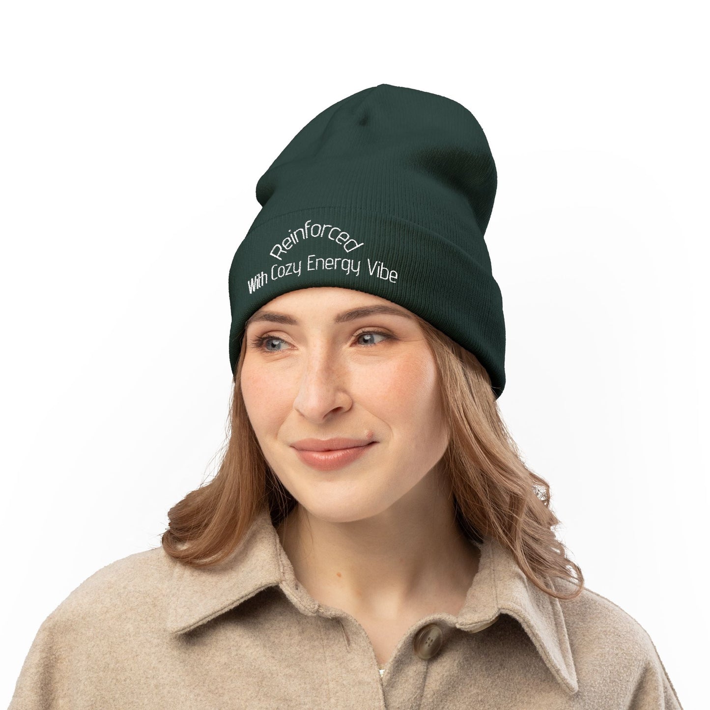 woman wearing dark green knit beanie with embroidered text, cozy winter hat accessory