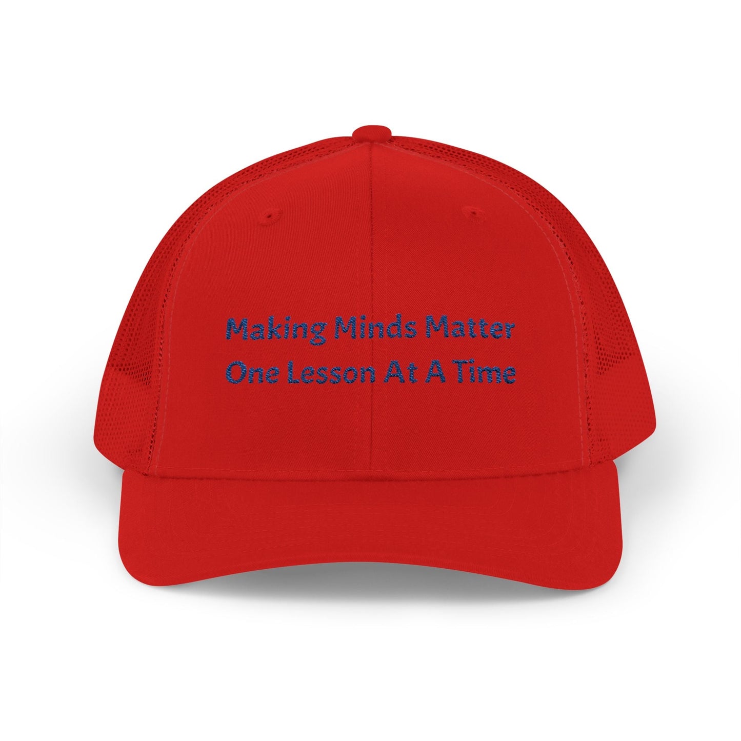 Red snapback trucker cap with blue embroidered text "Making Minds Matter One Lesson At A Time" and breathable mesh back panels