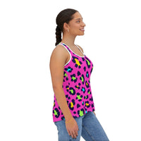 woman wearing vibrant leopard print tank top with high cut neckline and multicolor spots