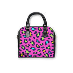 vibrant leopard print colorful handbag with black handles and adjustable shoulder strap