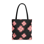Colorful AOP Tote Bag with pink floral pattern on black background, reusable and stylish shopping bag with black handles