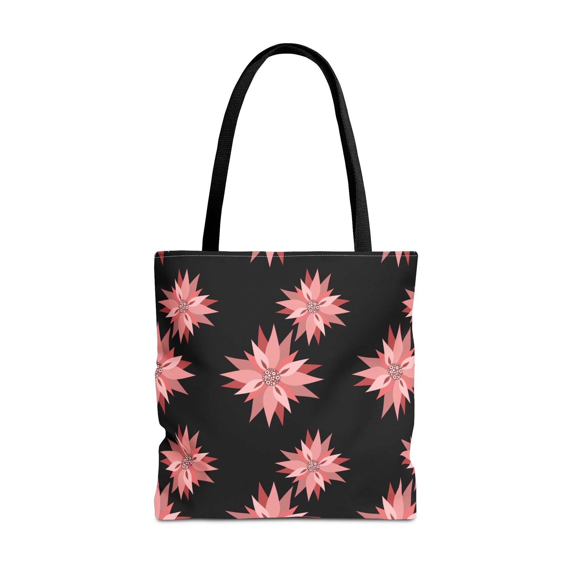 Colorful AOP Tote Bag with pink floral pattern on black background, reusable and stylish shopping bag with black handles