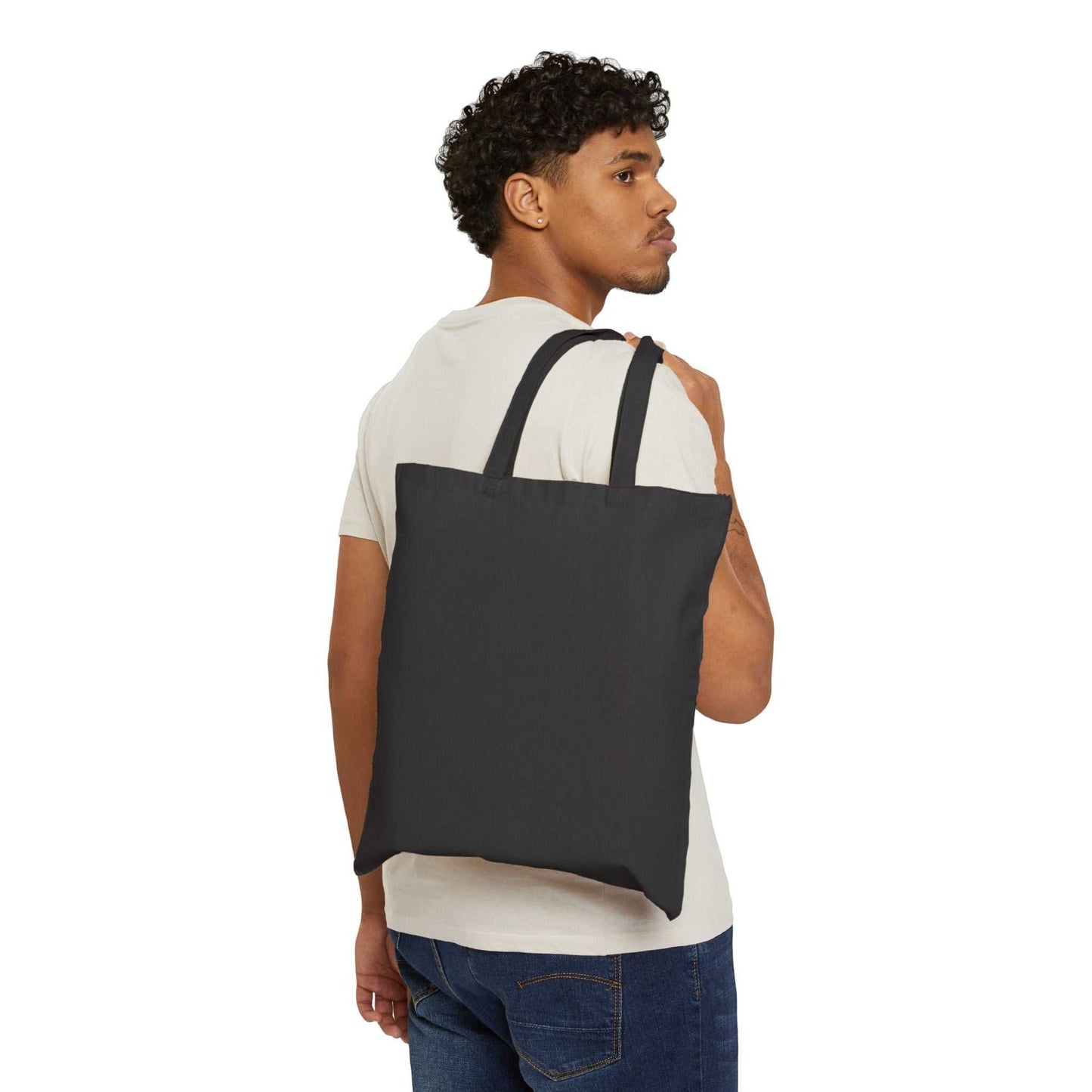 Man carrying black cotton canvas tote bag on shoulder, Best Mom Ever design tote bag alternative to plastic bags, durable eco-friendly 100% cotton bag for everyday use