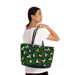 Stylish leopard print shoulder bag in green with black straps worn by woman