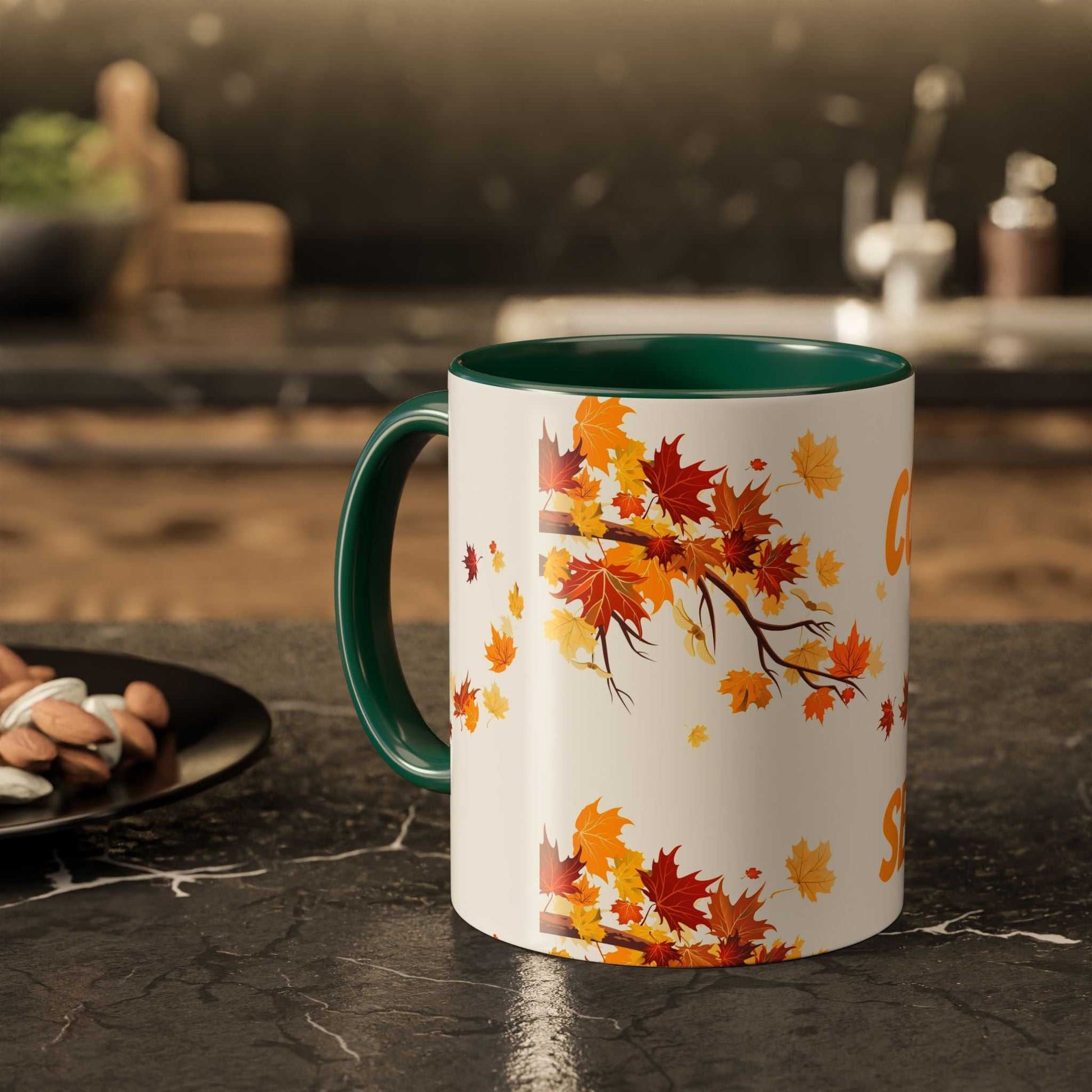 Fall cozy season mug with colorful autumn leaves design and green handle on kitchen counter