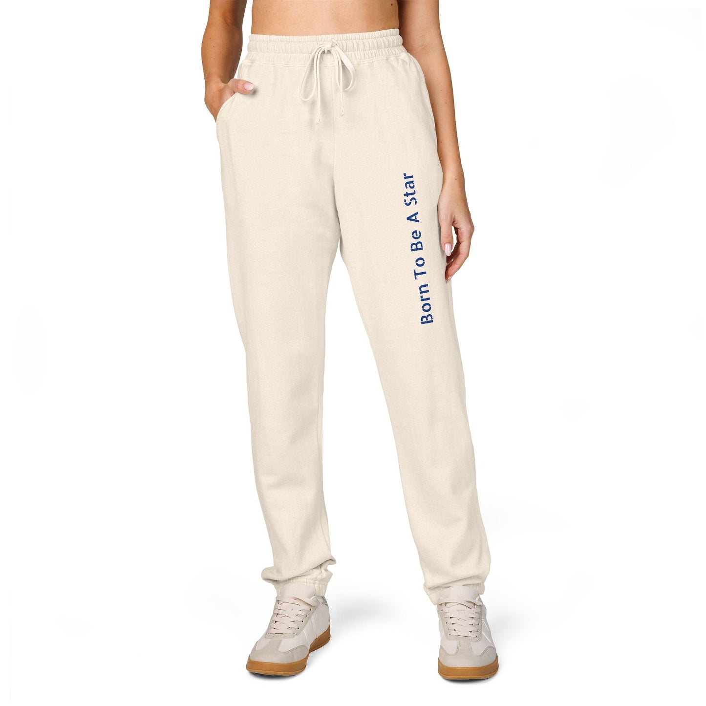 Comfortable unisex fleece sweatpants in beige with "Born To Be A Star" text, relaxed fit, and drawstring waist.