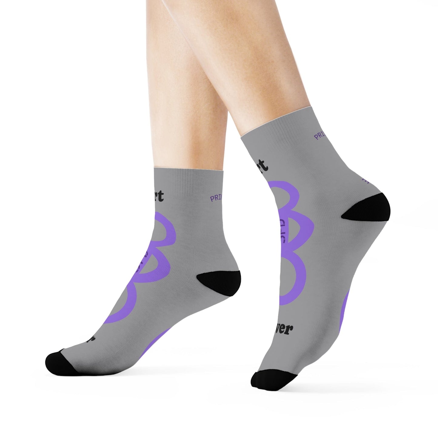 Gray socks with purple and black designs on a white background
