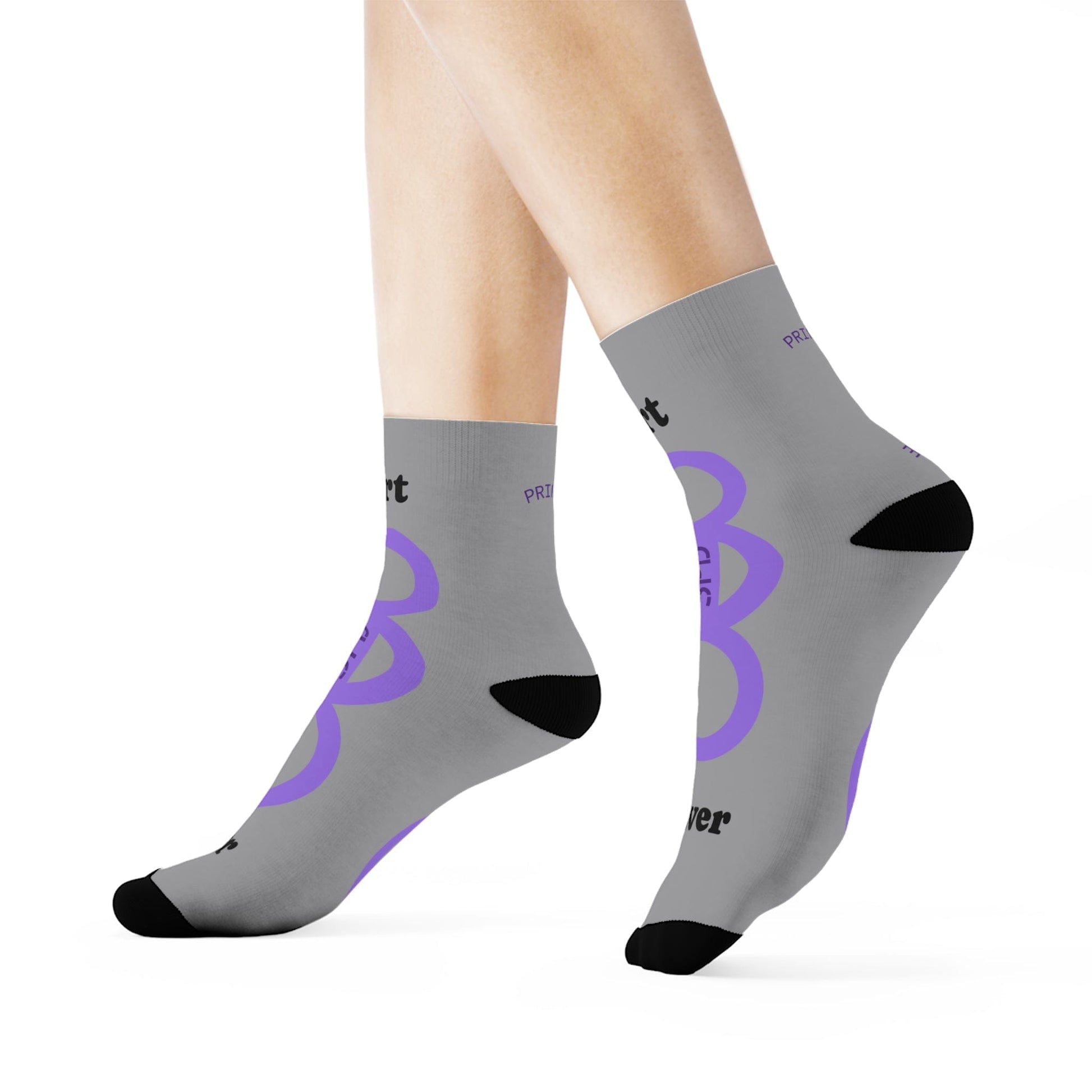 Gray socks with purple and black designs on a white background