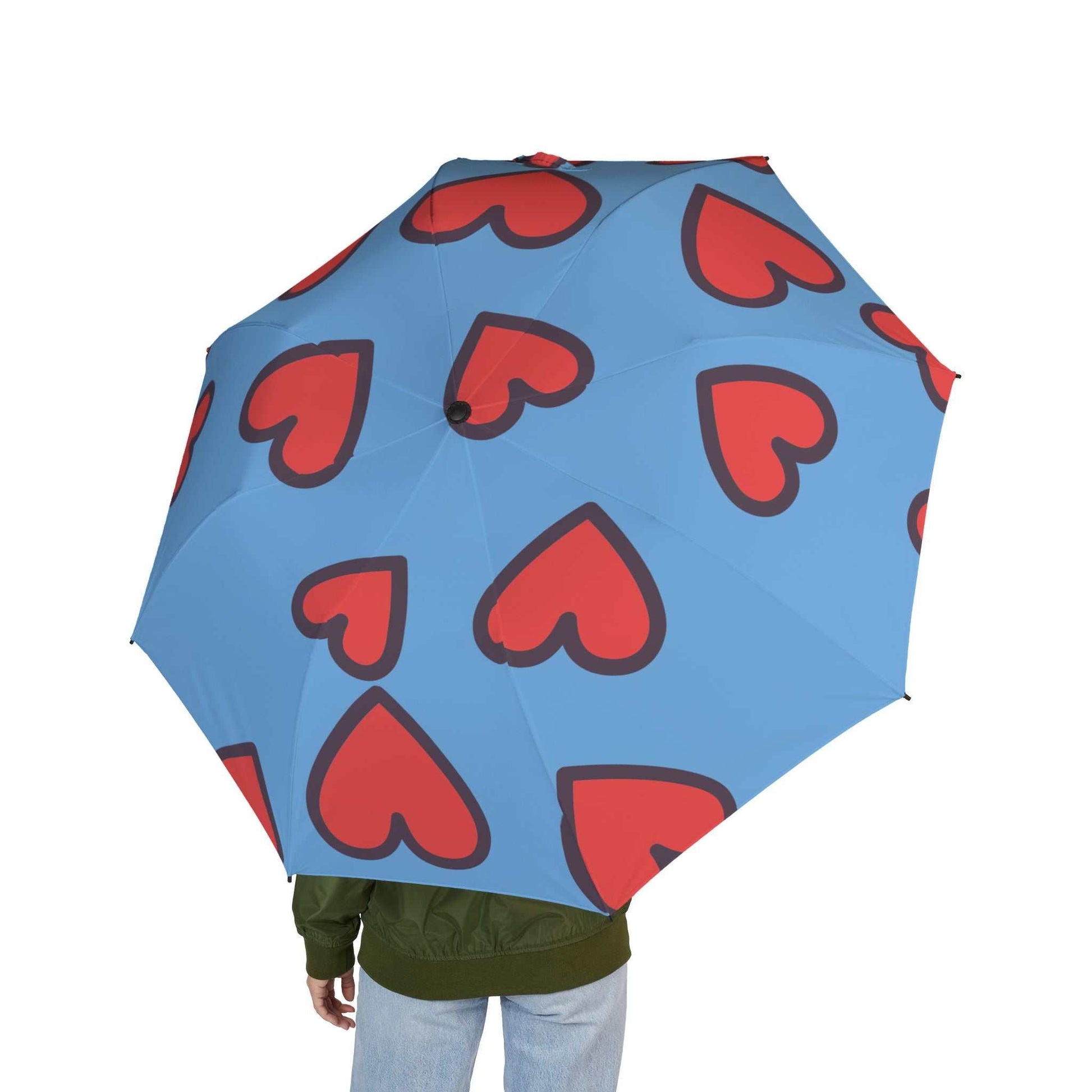 Blue foldable umbrella with red heart prints, lightweight and semi-automatic for travel use