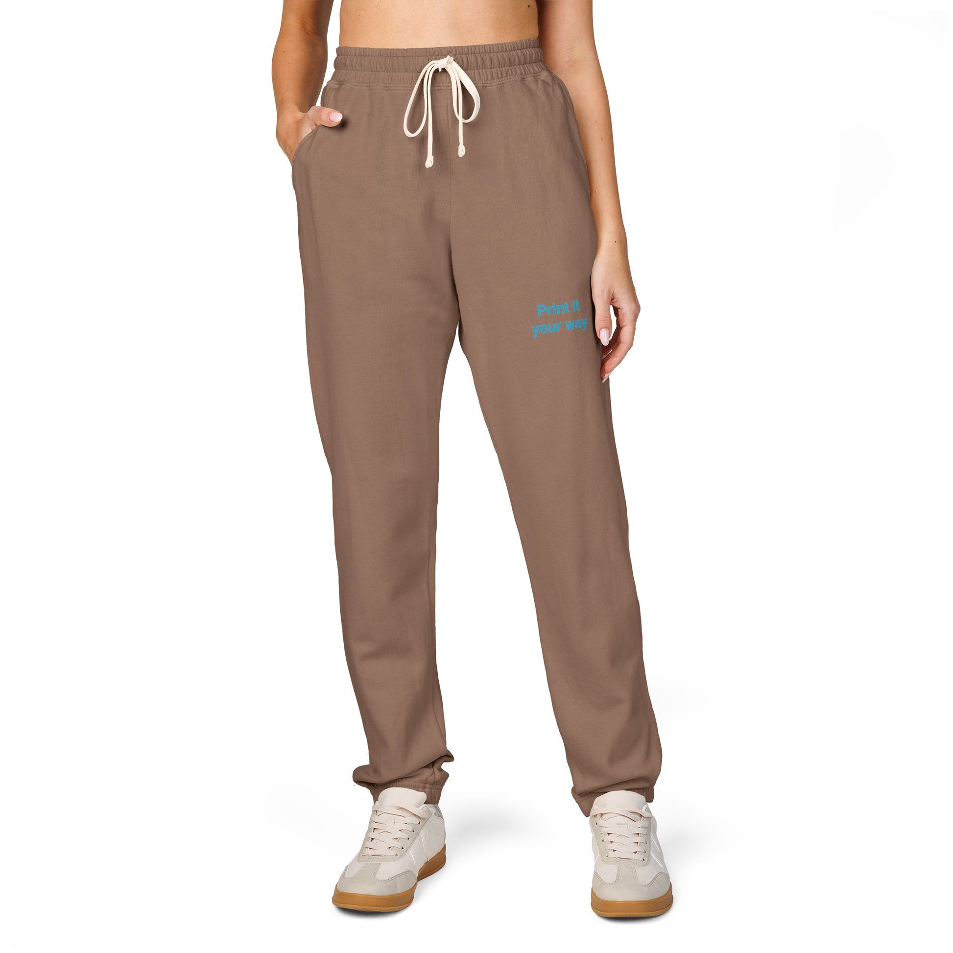Brown sweatpants with a brand logo on a white background