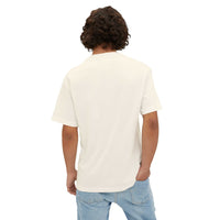Back view of a person wearing a white unisex oversized tee with a relaxed fit and dropped shoulders