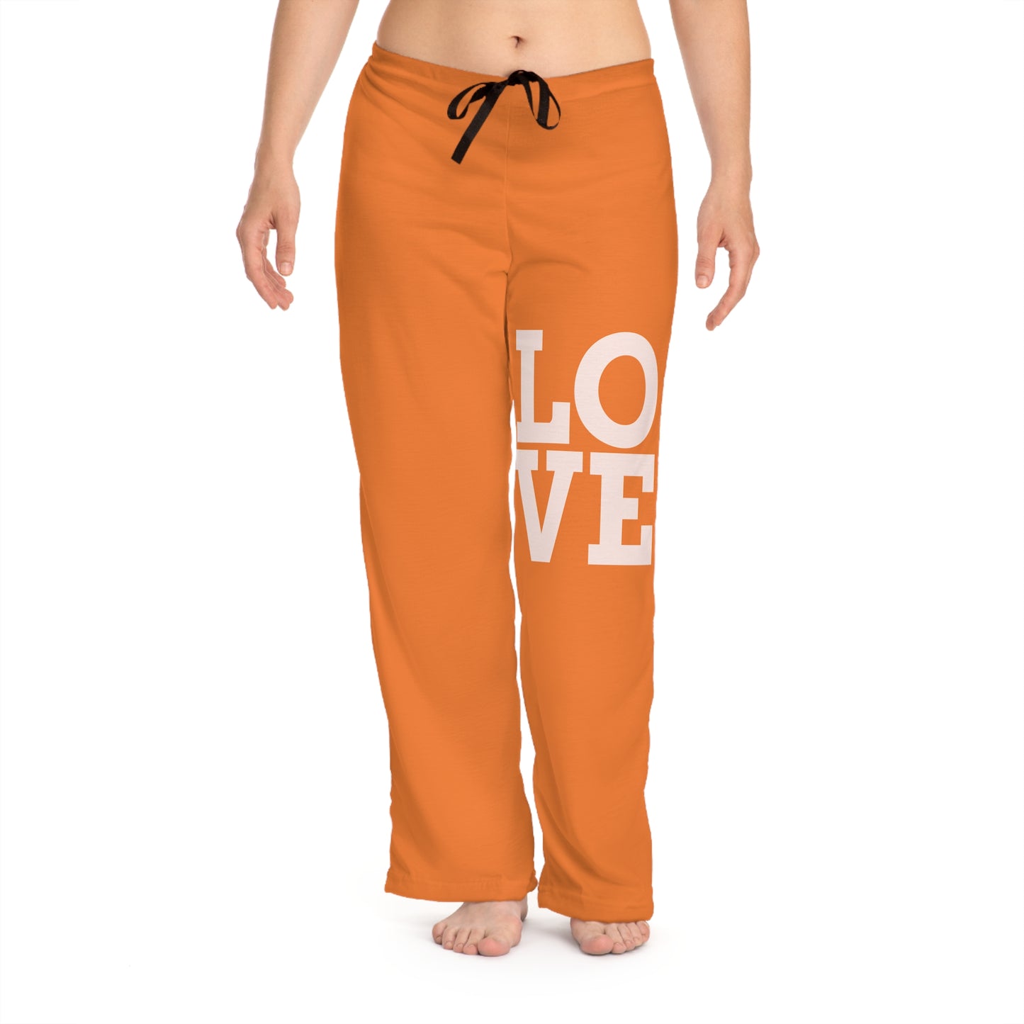 Orange sweatpants with 'LOVE' printed on them against a white background
