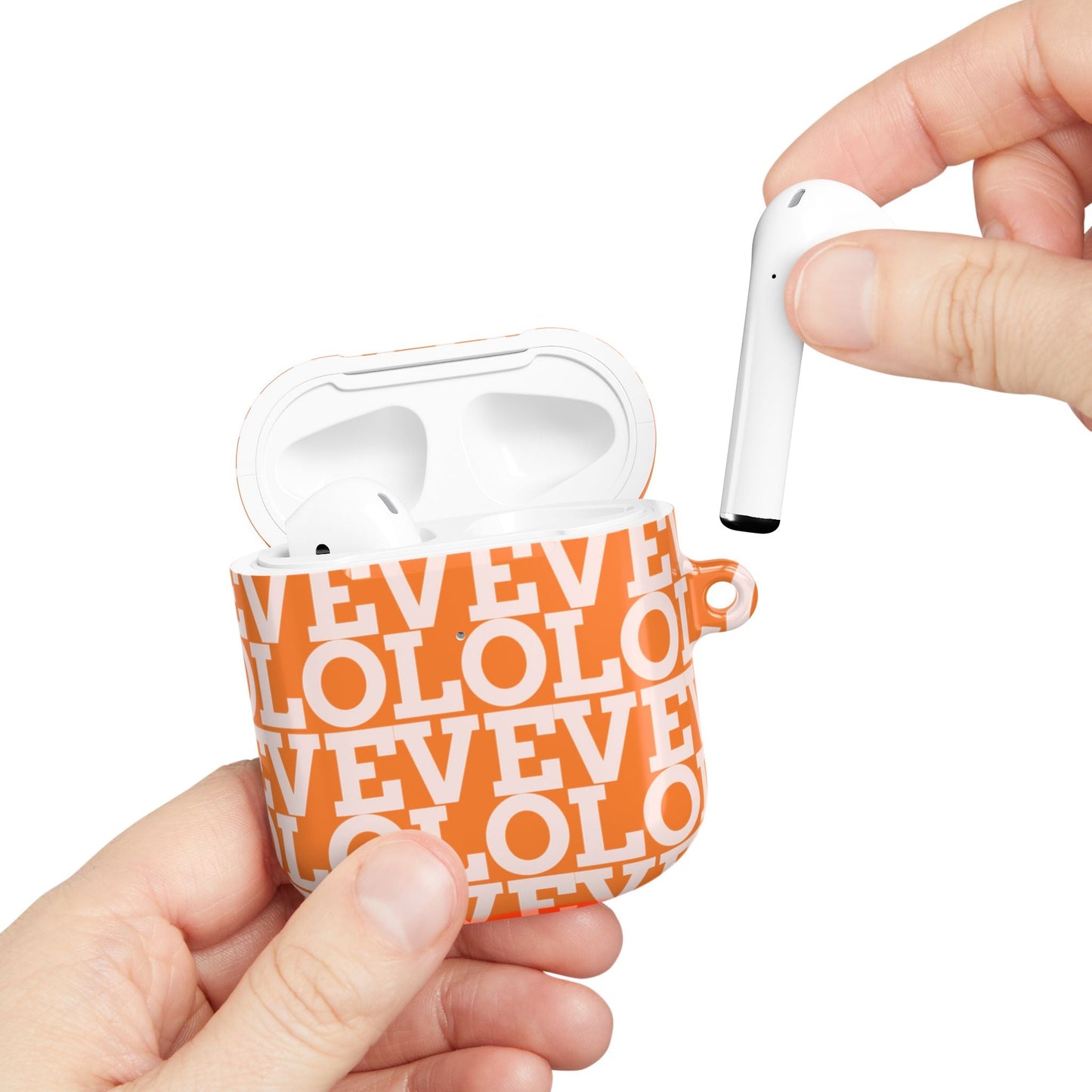 Orange patterned polycarbonate AirPod case with carabiner and hand placing AirPod inside