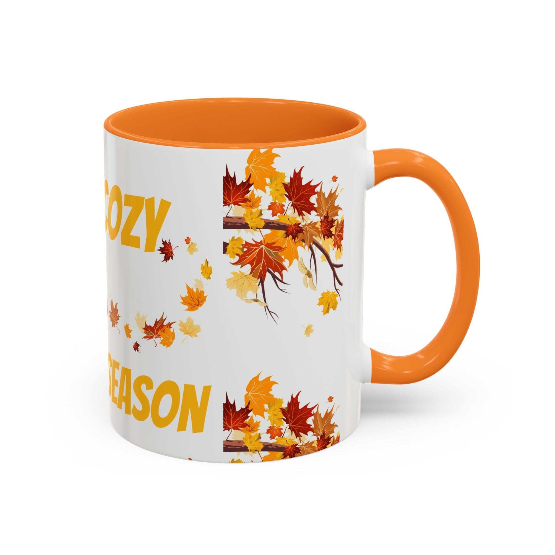 Fall cozy season mug with orange handle and autumn leaves design for Thanksgiving and seasonal drinks