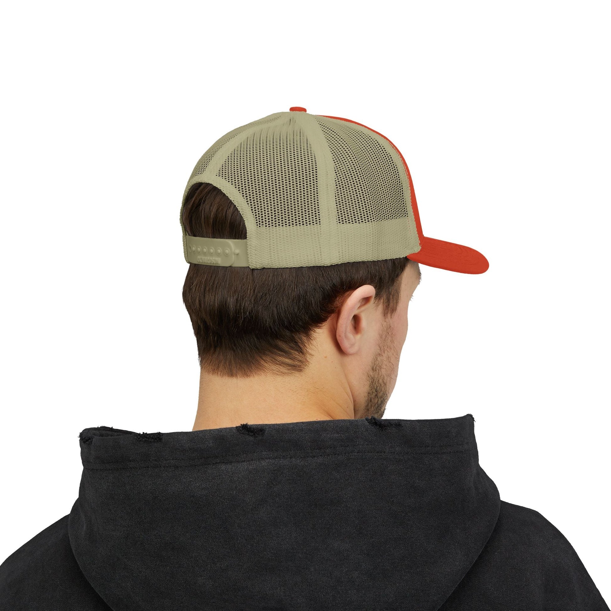 Rear view of man wearing beige and red snapback trucker cap with mesh back and adjustable snap closure