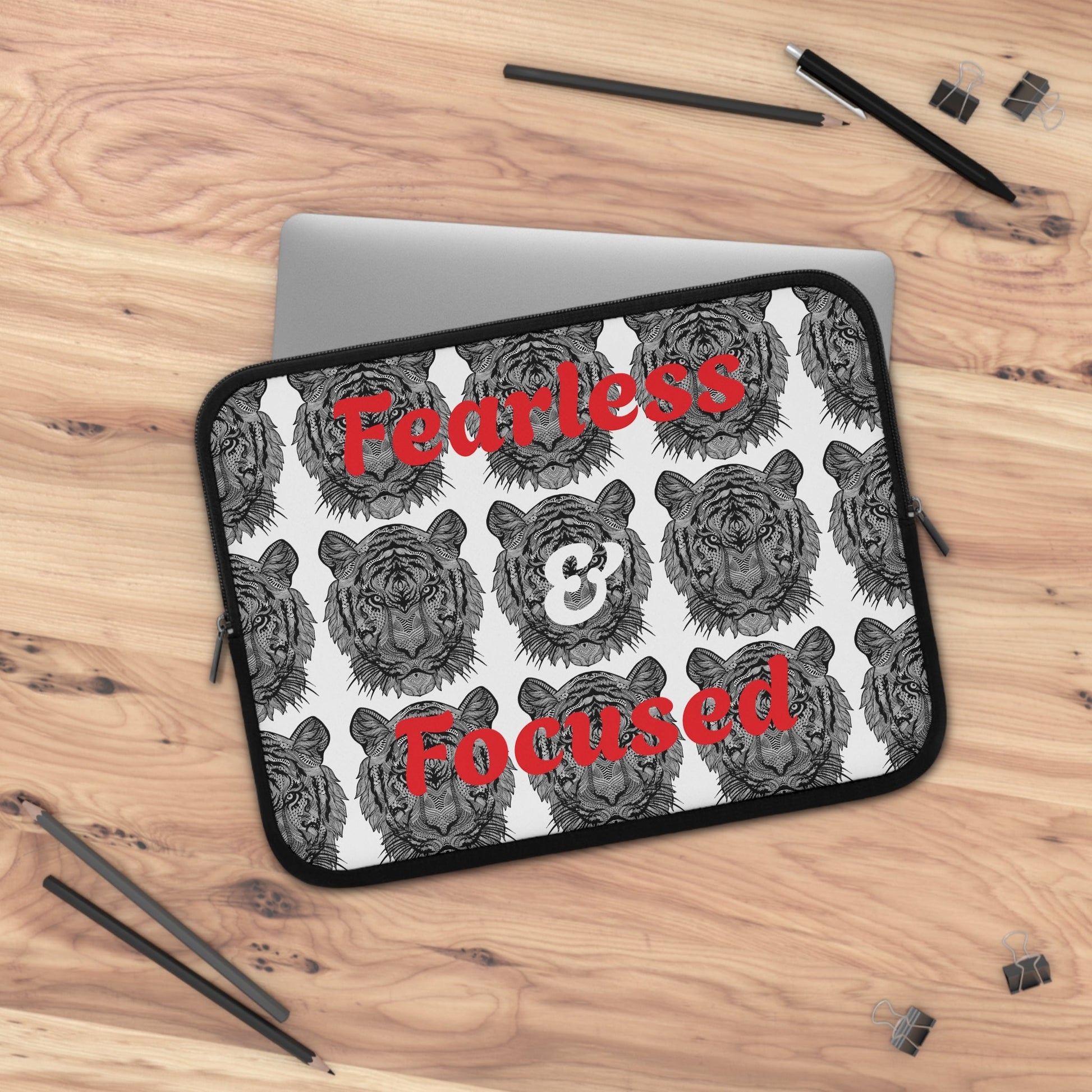 Laptop sleeve with tiger faces and red Fearless & Focused text, neoprene water-resistant design