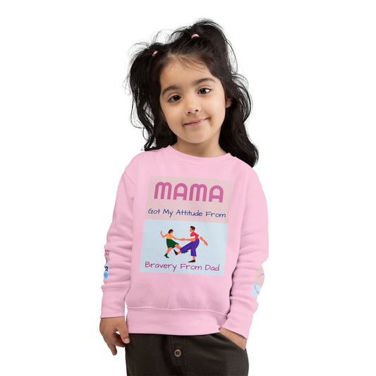 Toddler wearing pink Mama's Attitude sweatshirt with playful graphic and cozy design