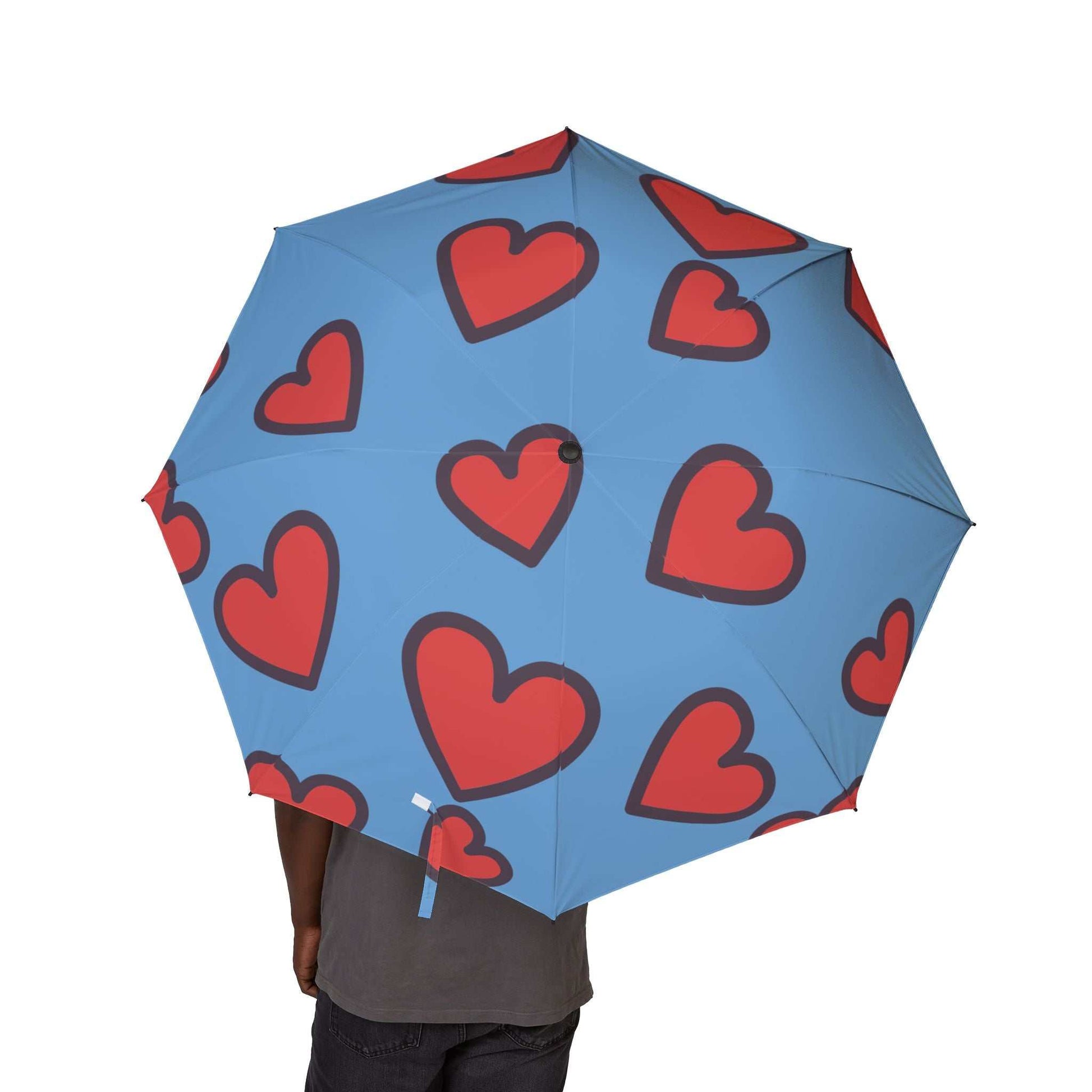Heart print foldable umbrella with vibrant blue background and red hearts, lightweight and portable for travel and daily use