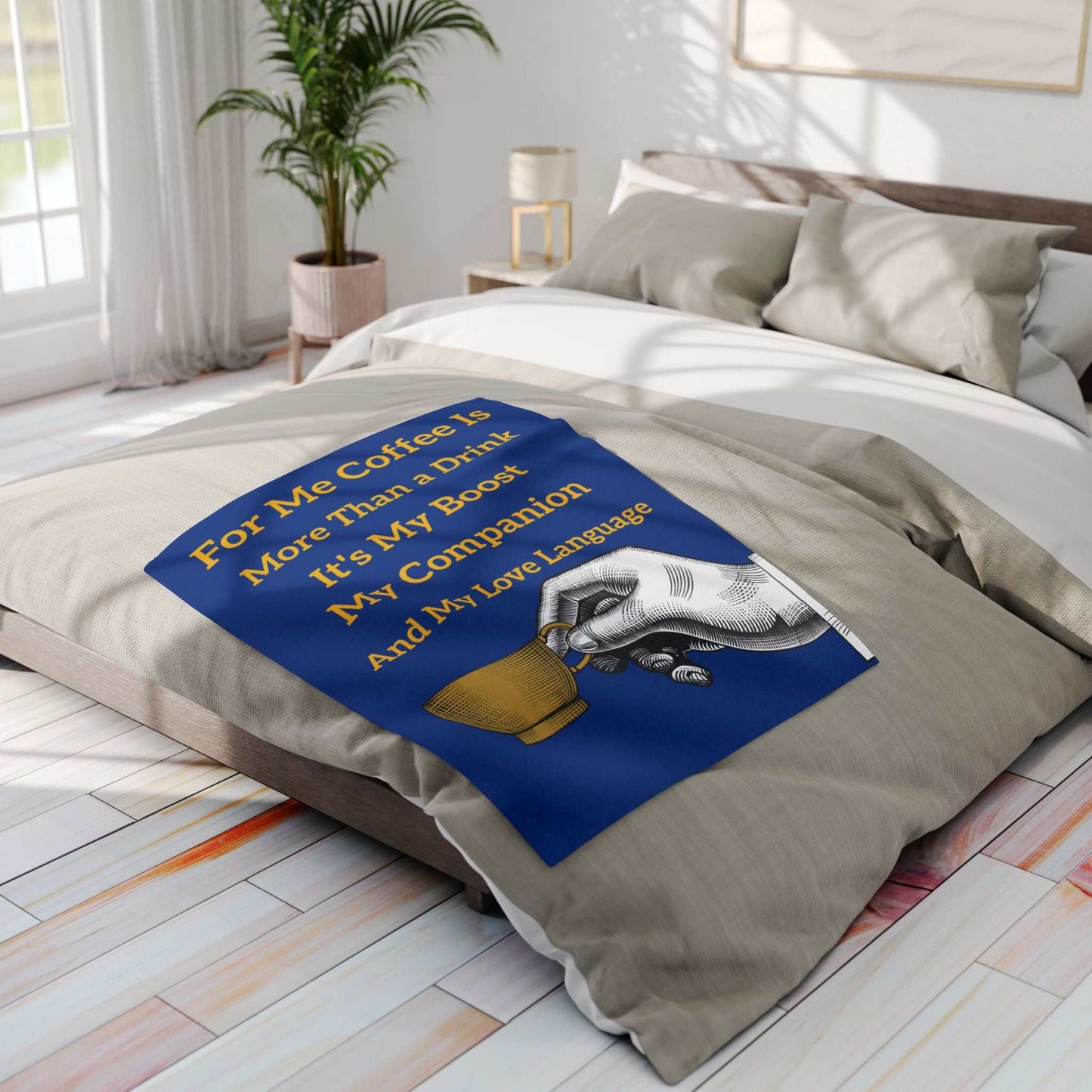 Coffee Lover's Cozy Fleece Blanket with coffee cup design on bed in modern bedroom