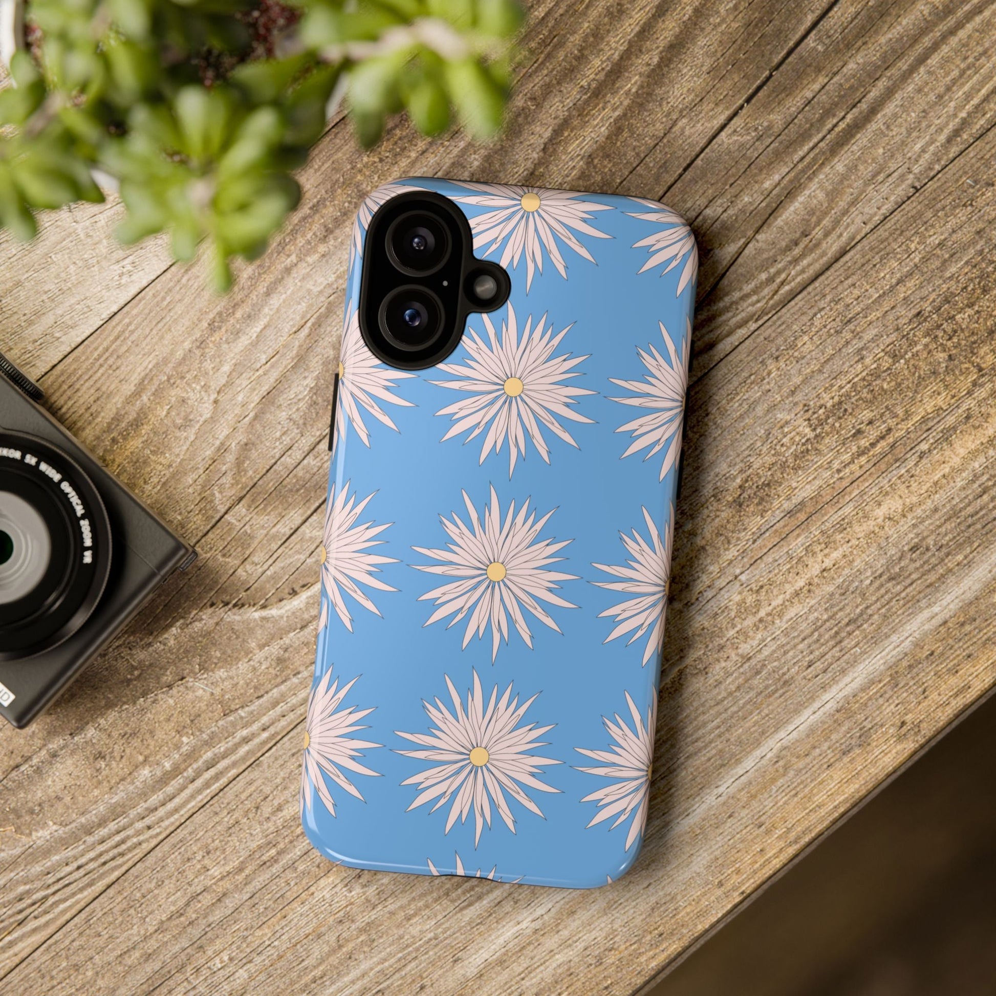 Blue phone case with white daisy pattern for durable phone protection