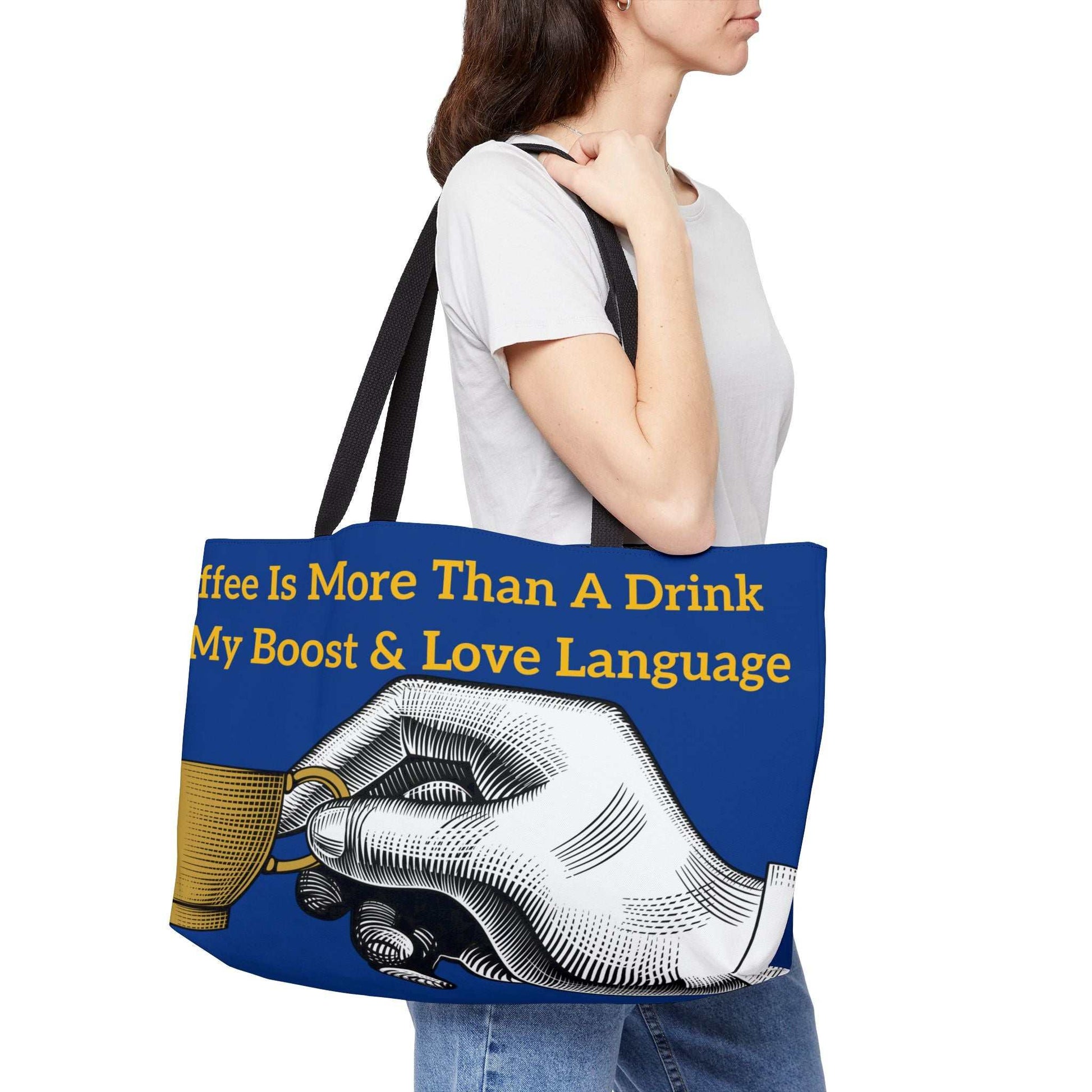 Coffee Lover's Weekender Tote Bag with coffee-themed design and durable black handles worn by woman