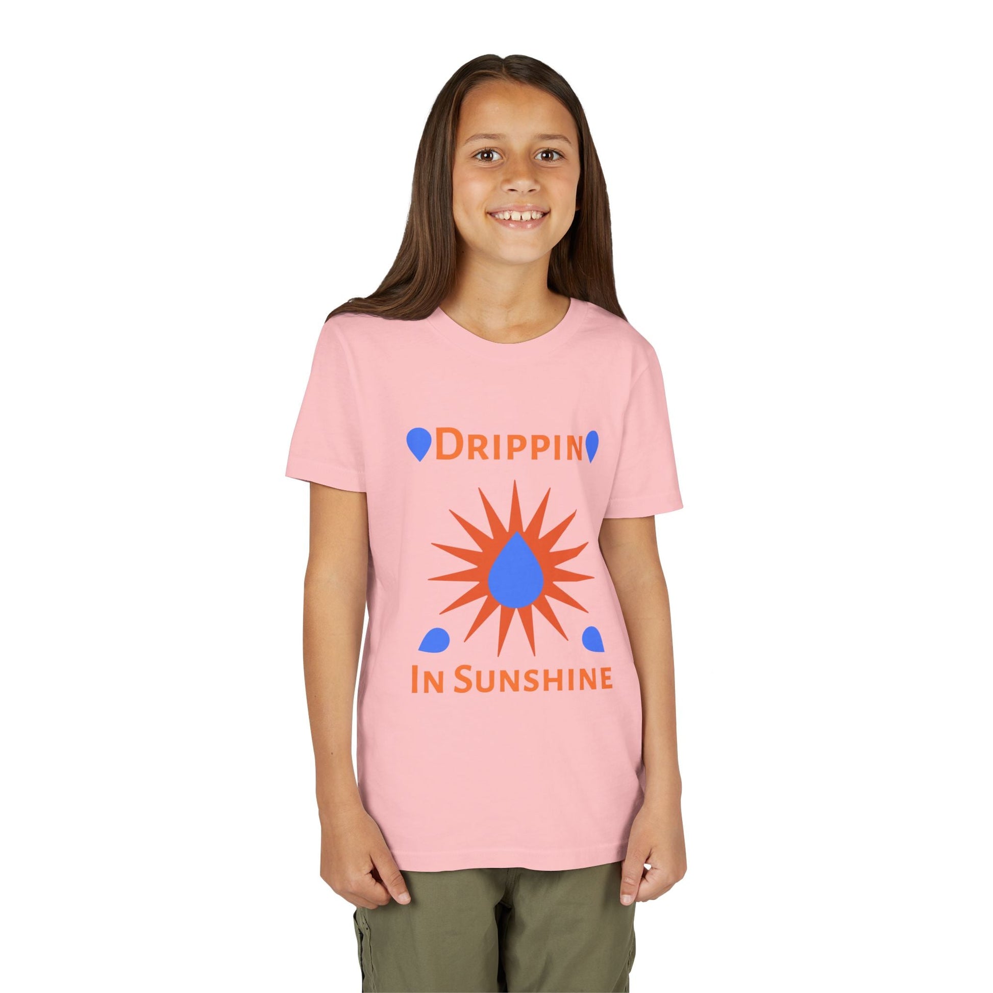 Youth short sleeve tee with custom Drippin in Sunshine design on pink shirt worn by smiling child