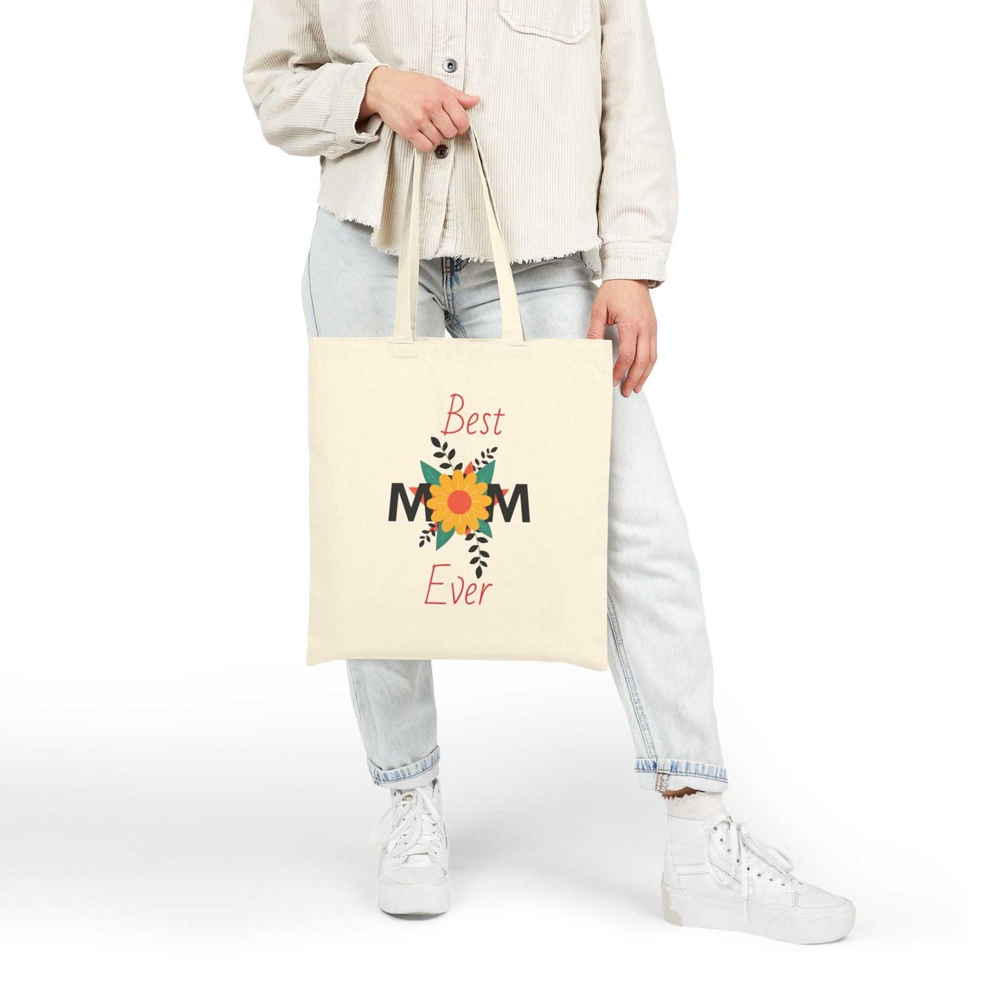 Woman holding Best Mom Ever cotton canvas tote bag with floral design