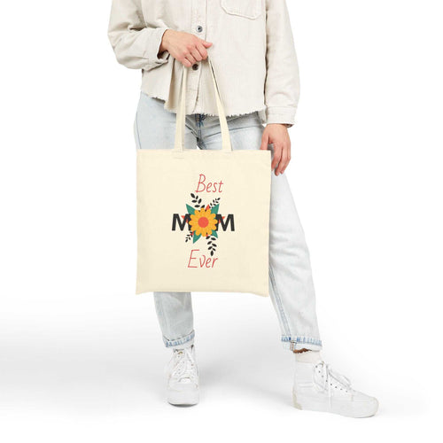 Woman holding Best Mom Ever cotton canvas tote bag with floral design