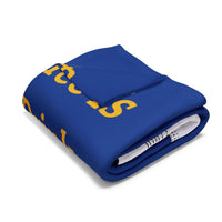 Folded blue Coffee Lover's Cozy Fleece Blanket with yellow text on white background