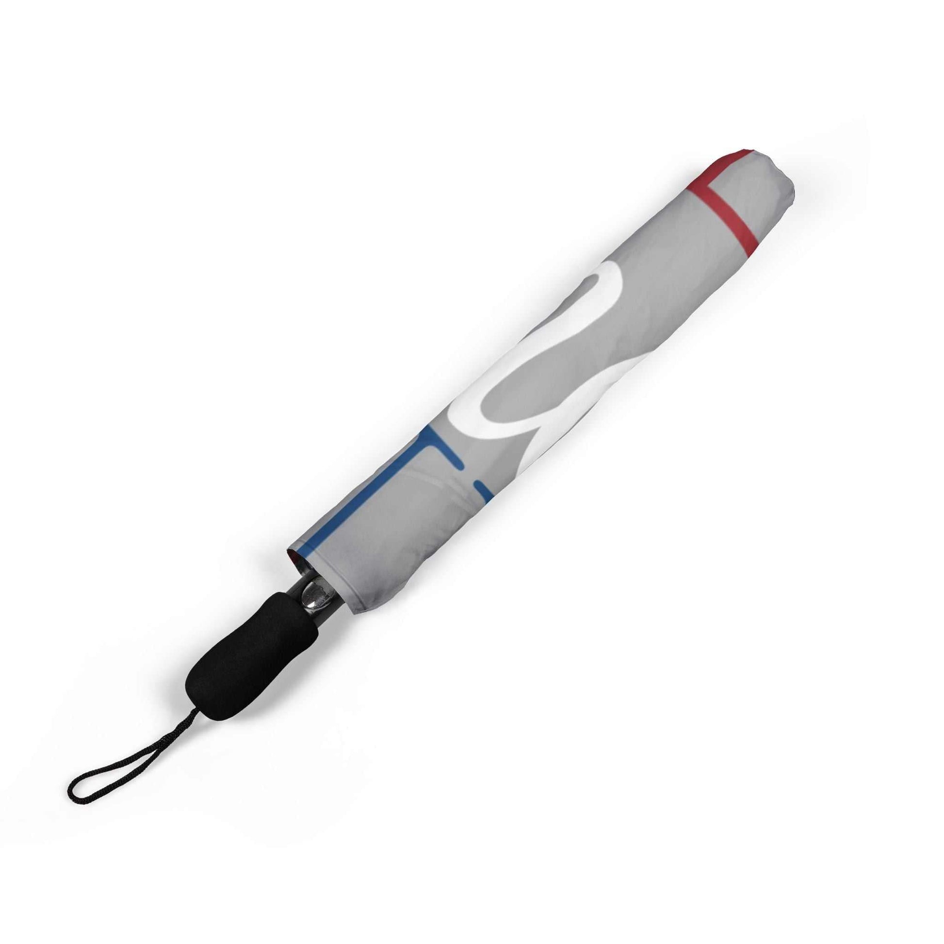 Compact foldable umbrella with semi-automatic open, durable polyester canopy, and comfortable rubber handle for travel and rain protection