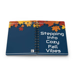 Autumn-inspired spiral bound journal with colorful fall leaves cover and cozy fall vibes text