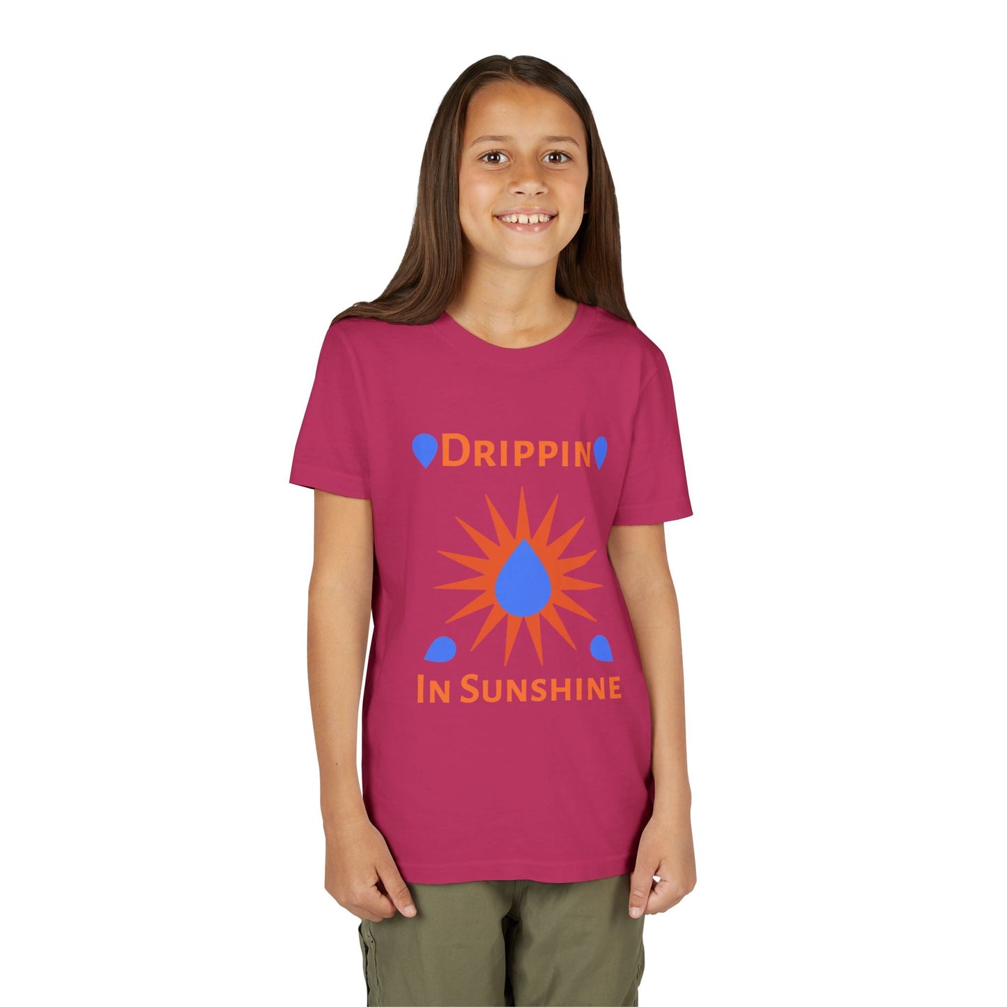 Child wearing pink youth short sleeve tee with "Drippin' in Sunshine" graphic and sun design