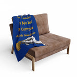 Coffee Lover's Cozy Fleece Blanket draped on brown couch with blue and yellow coffee-themed design