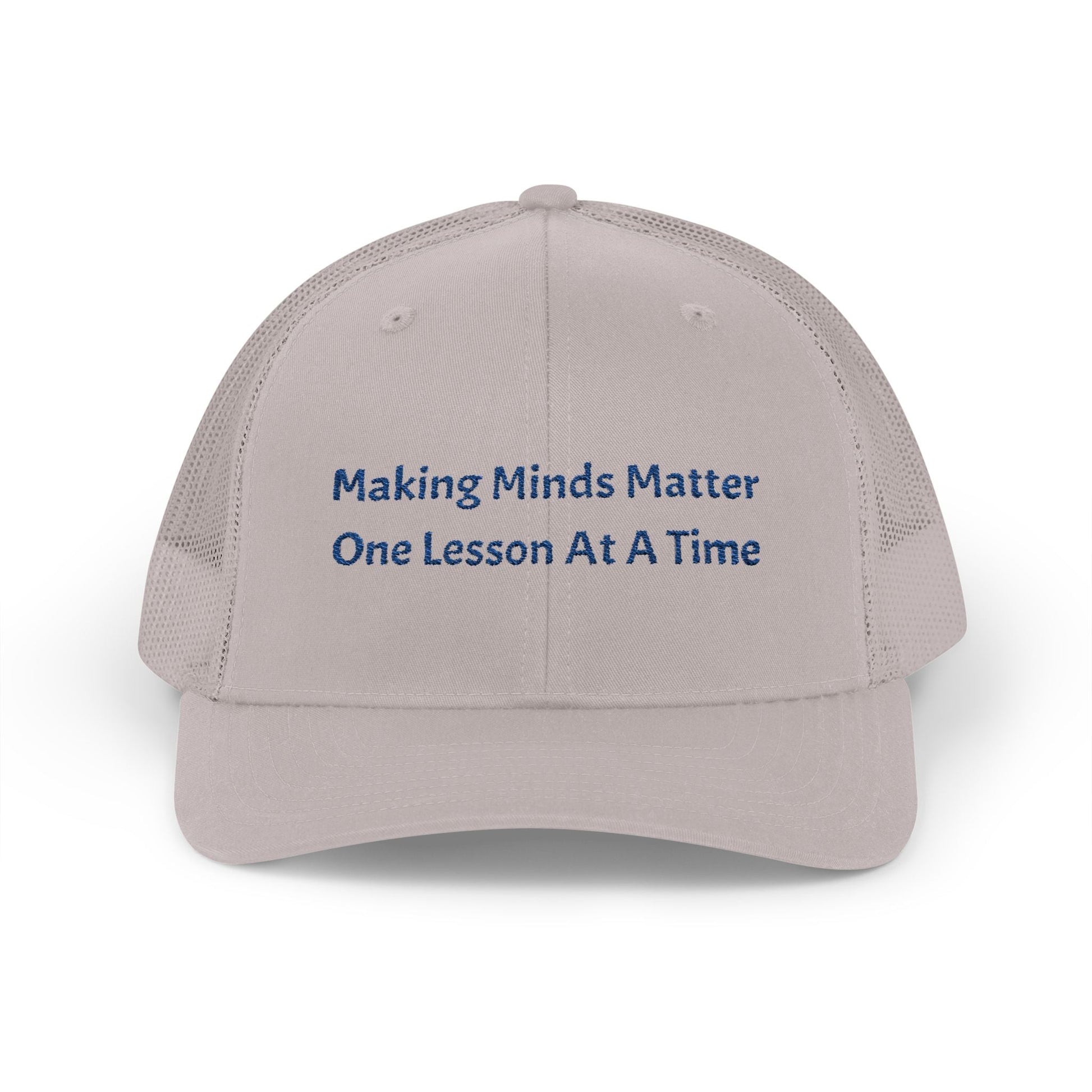 Beige snapback trucker cap with mesh back and embroidered motivational text on front panel