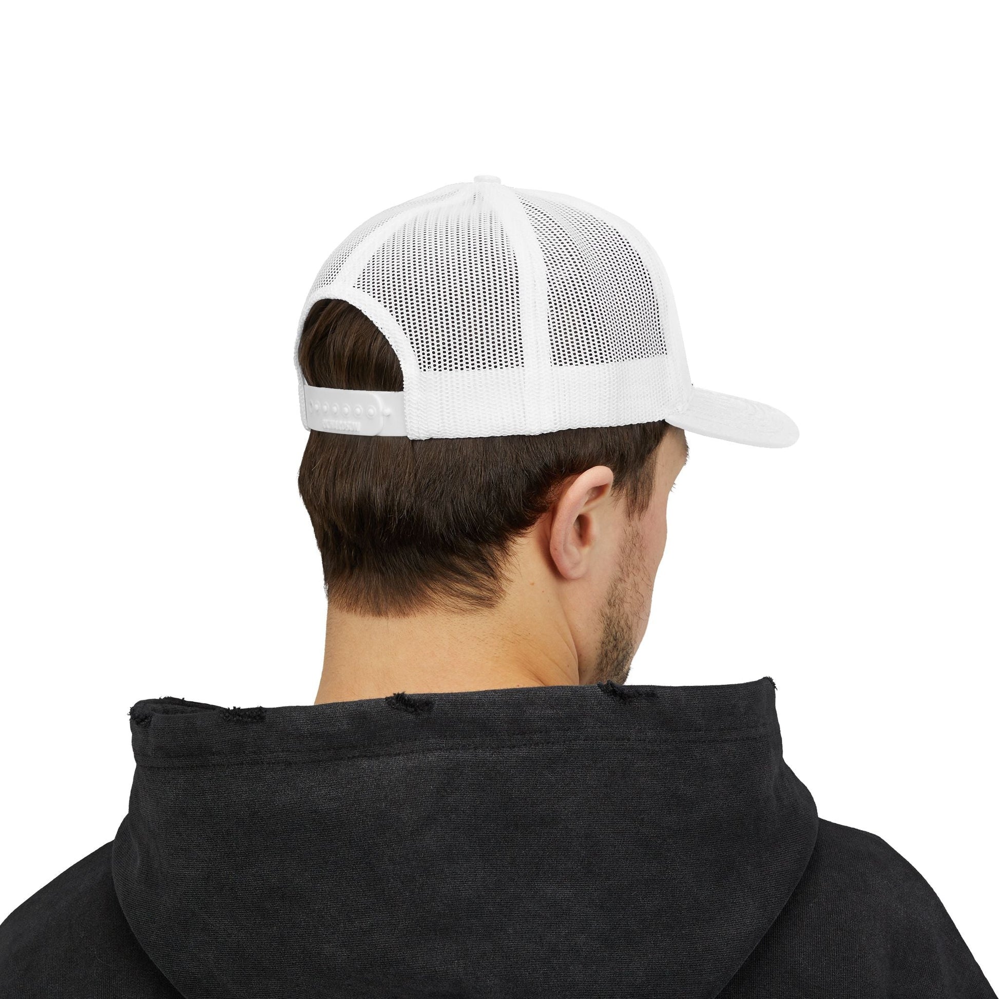 Man wearing white snapback trucker cap with mesh back and adjustable snap closure
