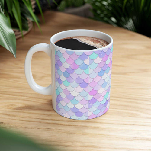 Vibrant Shell Ceramic Mug with colorful shell pattern and glossy finish on wooden table with coffee inside