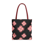 Colorful AOP tote bag with pink floral pattern on black background and red handles, reusable shopping bag for everyday use