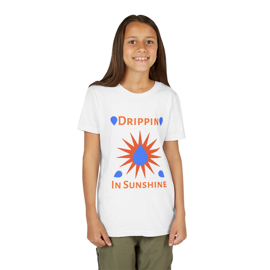 Child wearing white youth short sleeve tee with colorful "Drippin in Sunshine" graphic design