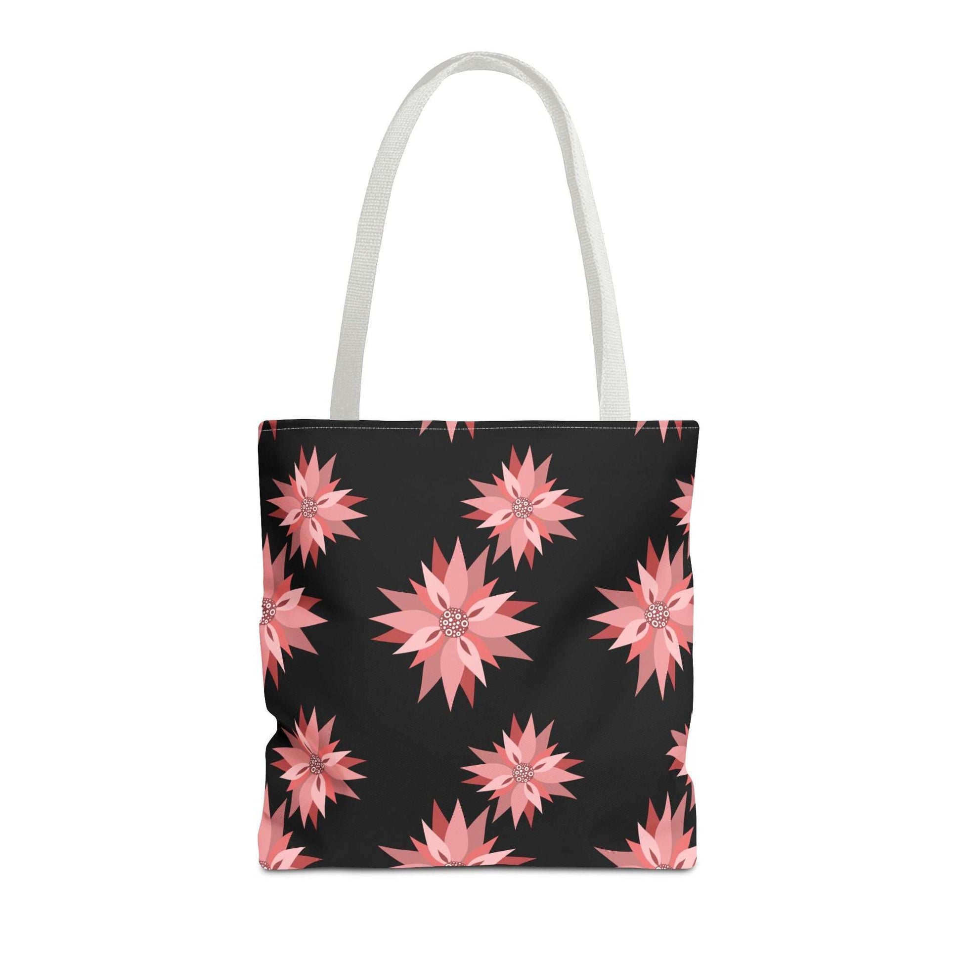 Colorful AOP Tote Bag with pink floral pattern on black background and white handles, reusable shopping bag