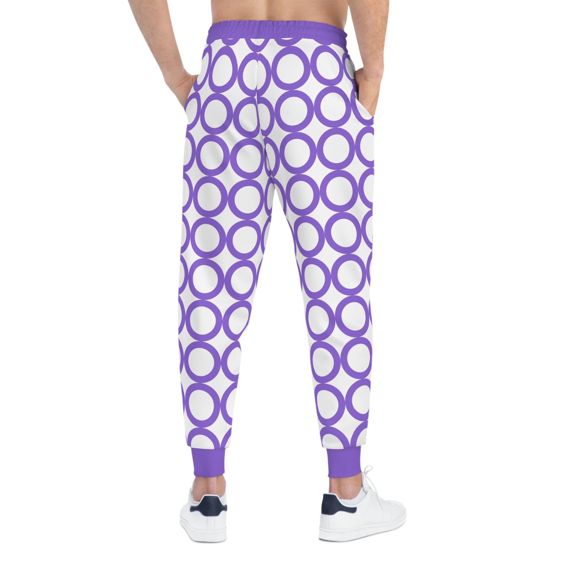 Stylish athletic joggers with purple circle pattern, drawstring waist, and side pockets for activewear.