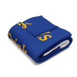 Folded blue Coffee Lover's Cozy Fleece Blanket with yellow text design for home decor and gifts