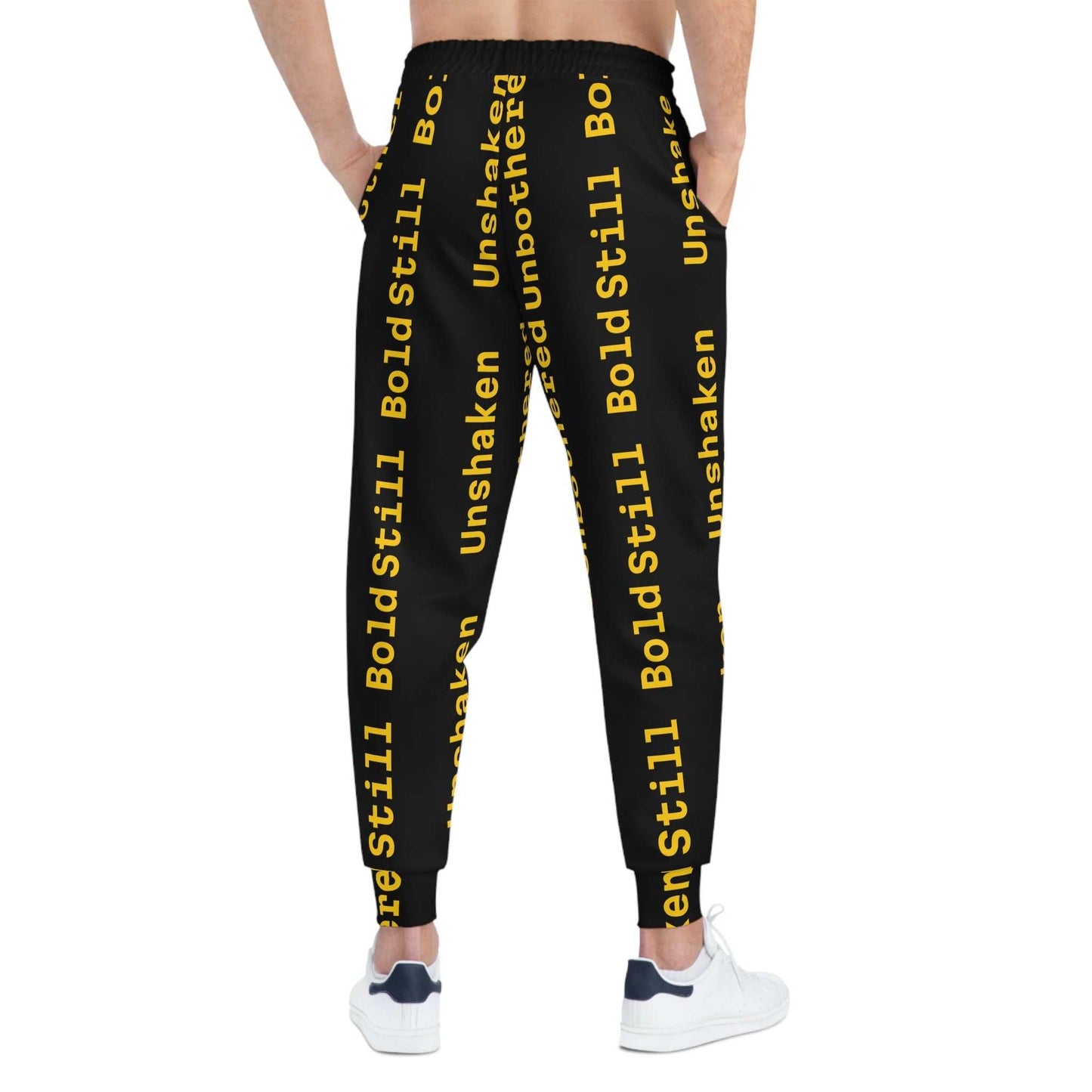 Eco-friendly black joggers with bold yellow motivational text, adjustable waistband, side pockets, and tapered ankle cuffs for casual and athletic wear