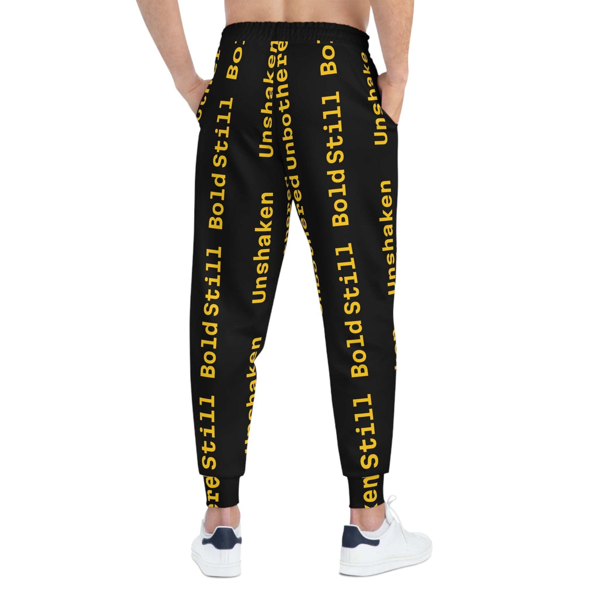 Eco-friendly black joggers with bold yellow motivational text, adjustable waistband, side pockets, and tapered ankle cuffs for casual and athletic wear