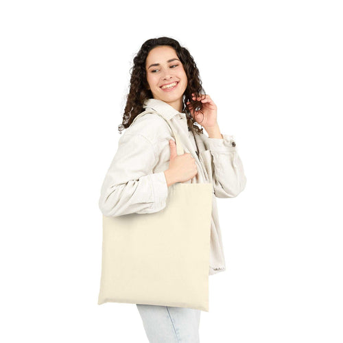 Woman holding beige Best Mom Ever cotton canvas tote bag with reinforced handles