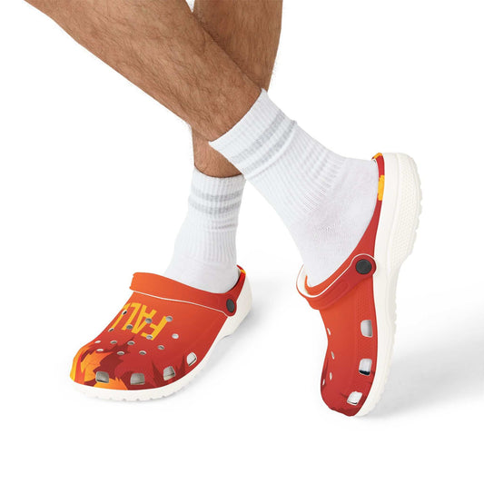 Fall-themed EVA foam clogs in vibrant orange with autumn leaf design worn with white socks