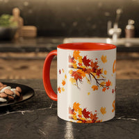 Fall cozy season mug with orange handle and autumn leaves design for hot beverages