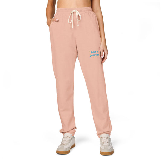 Pink sweatpants with text on a white background