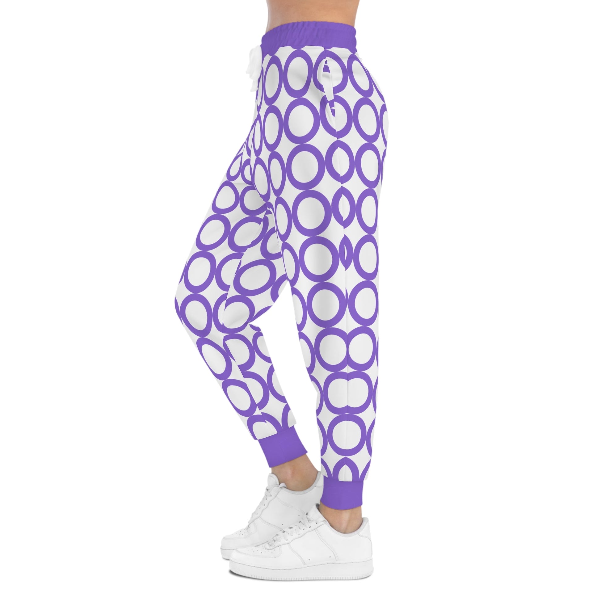 Stylish athletic joggers with purple and white circular print, adjustable waistband, and side pockets