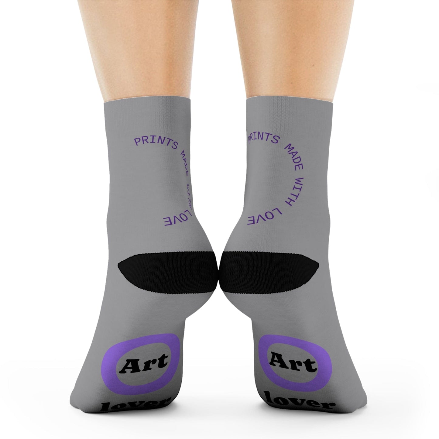 Gray socks with black and purple text and design on a white background