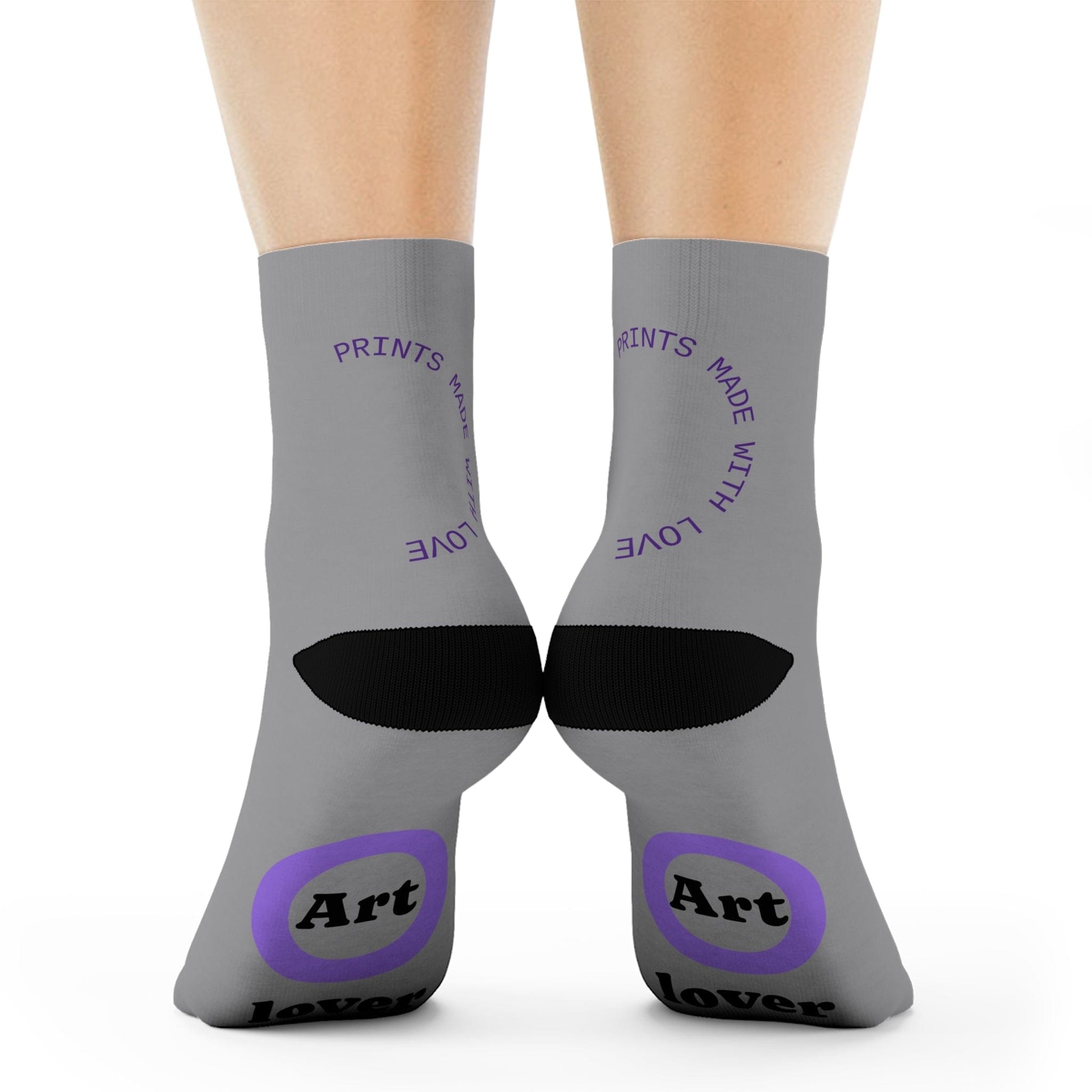 Gray socks with black and purple text and design on a white background